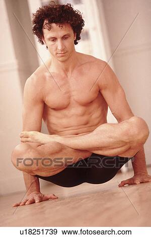 Man doing yoga pose View Large Photo Image Stock Photo - Man doing yoga pose. Fotosearch