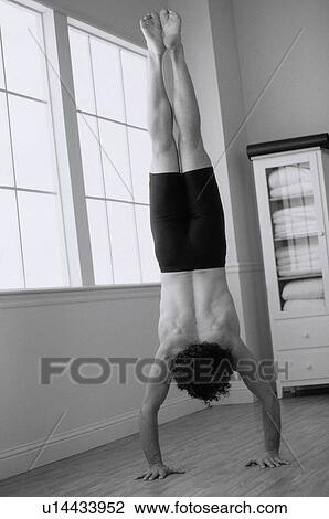 Stock Image - Man doing yoga. Fotosearch