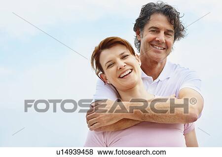 Man embracing woman View Large Photo Image Stock Photo - Man embracing woman. Fotosearch