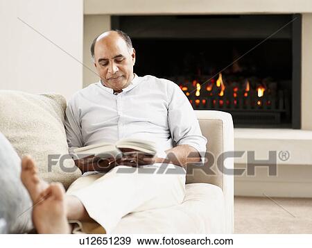 Stock Photo - Man reading a book. Fotosearch