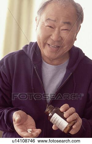 Man taking prescription medication View Large Photo Image Stock Photograph - Man taking prescription medication. Fotosearch