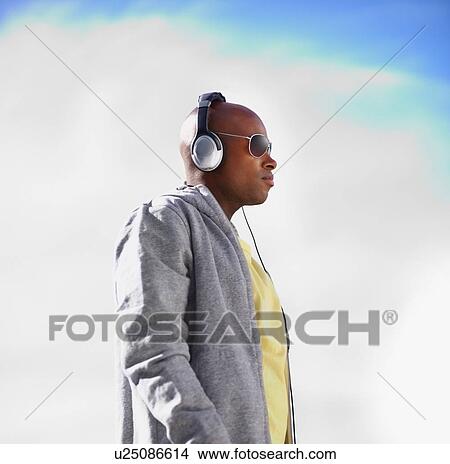 Man wearing headphones View Large Photo Image Picture - Man wearing headphones. Fotosearch