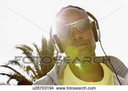Man wearing headphones View Large Photo Image Picture - Man wearing headphones. Fotosearch