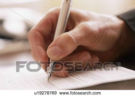 Man writing with a pen View Large Photo Image Stock Photo - Man writing with a pen. Fotosearch