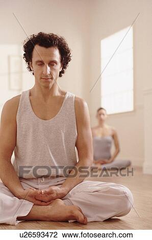 Stock Image - Meditating. Fotosearch