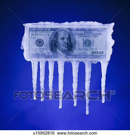Stock Photograph - Money covered in ice. Fotosearch