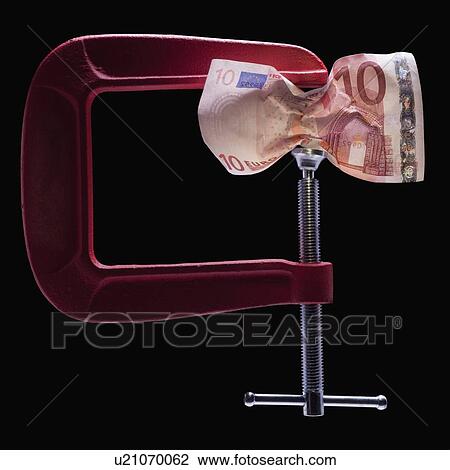 Money in a clamp View Large Photo Image Stock Image - Money in a clamp. Fotosearch