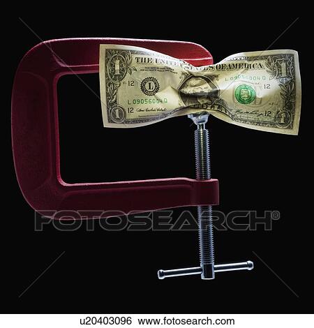 Money in a clamp View Large Photo Image Stock Photograph - Money in a clamp. Fotosearch