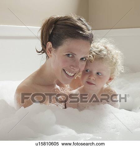 Stock Photography - Mother and child having bubble bath. Fotosearch