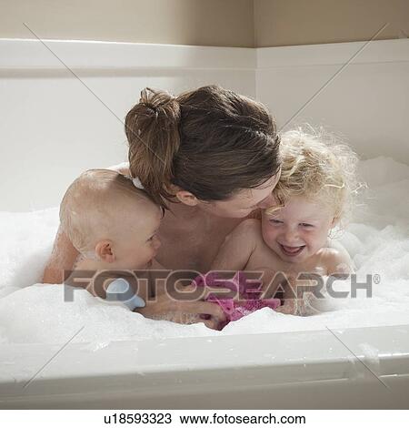 Mother and children having bubble bath View Large Photo Image Stock Image - Mother and children having bubble bath. Fotosearch