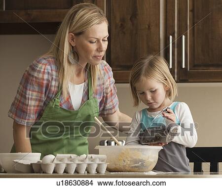 Mother and daughter baking View Large Photo Image Picture - Mother and daughter baking. Fotosearch