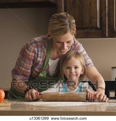 Mother and daughter baking View Large Photo Image Stock Photo - Mother and daughter baking. Fotosearch
