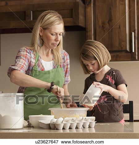Mother and daughter baking View Large Photo Image Stock Photo - Mother and daughter baking. Fotosearch