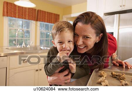Mother and son baking cookies View Large Photo Image Picture - Mother and son baking cookies. Fotosearch