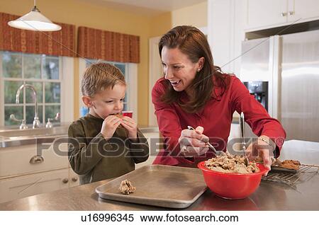 Mother and son baking cookies View Large Photo Image Stock Photography - Mother and son baking cookies. Fotosearch