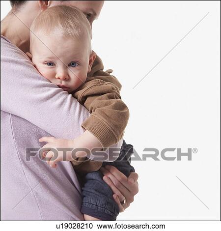 Mother and son embrace View Large Photo Image Stock Image - Mother and son embrace. Fotosearch