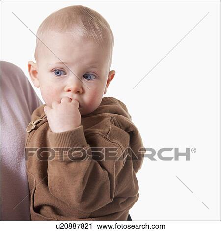 Stock Image - Mother and son embrace. Fotosearch