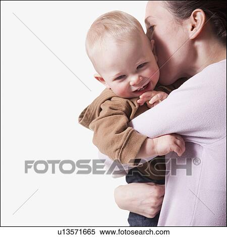 Stock Photography - Mother and son embrace. Fotosearch