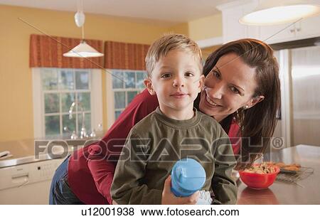 Mother and son in kitchen View Large Photo Image Stock Photo - Mother and son in kitchen. Fotosearch
