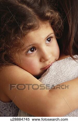 Mother comforting daughter View Large Photo Image Stock Photography - Mother comforting daughter. Fotosearch