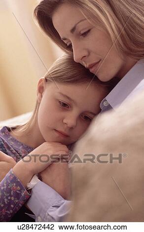 Mother consoling daughter View Large Photo Image Stock Image - Mother consoling daughter. Fotosearch