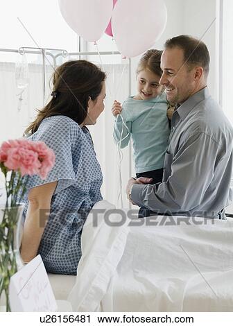 Mother in hospital bed View Large Photo Image Stock Image - Mother in hospital bed. Fotosearch