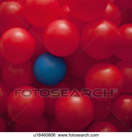 One blue ball amongst many red balls View Large Photo Image Stock Photograph - One blue ball amongst many red balls. Fotosearch
