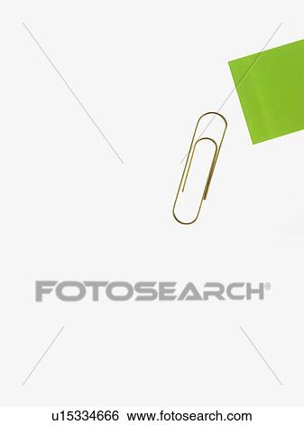 Stock Photograph - Paper clip and green paper. Fotosearch