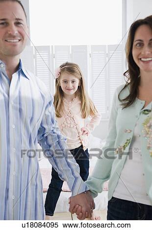 Stock Photography - Parents and their daughter. Fotosearch