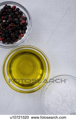 Stock Image - Peppercorns olive oil and sea salt. Fotosearch