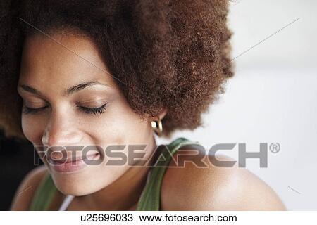 Portrait of a woman with her eyes closed View Large Photo Image Stock Image - Portrait of a woman with her eyes closed. Fotosearch