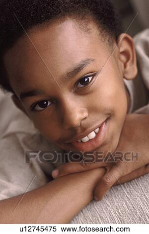 Portrait of a young boy View Large Photo Image Stock Photography - Portrait of a young boy. Fotosearch