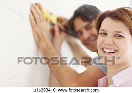 Preparing to hang a picture View Large Photo Image Stock Image - Preparing to hang a picture. Fotosearch