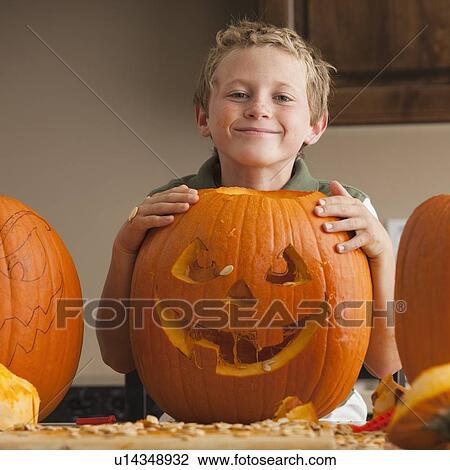 Stock Image - Pumpkin carving. Fotosearch