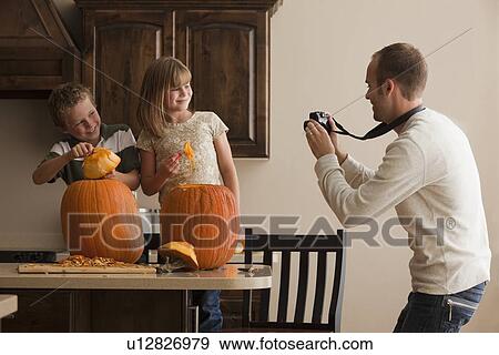 Stock Photo - Pumpkin carving. Fotosearch