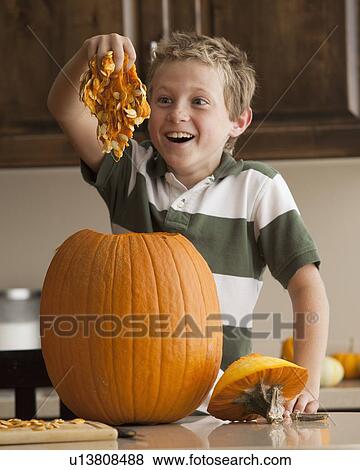 Stock Photo - Pumpkin carving. Fotosearch