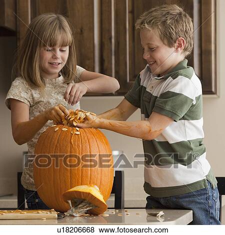Stock Photo - Pumpkin carving. Fotosearch