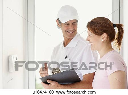 Repair person and customer View Large Photo Image Stock Image - Repair person and customer. Fotosearch