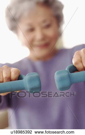 Stock Image - Senior exercising. Fotosearch