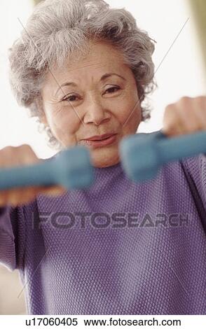 Senior woman exercising View Large Photo Image Stock Photography - Senior woman exercising. Fotosearch