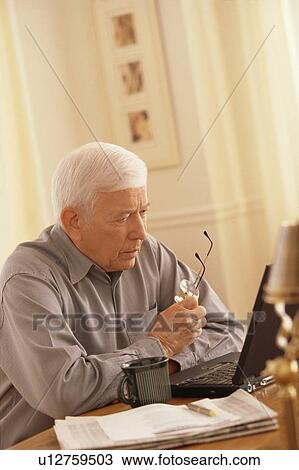 Senior working on laptop View Large Photo Image Stock Image - Senior working on laptop. Fotosearch