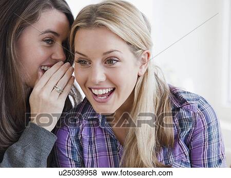 Stock Photo - Sharing a secret. Fotosearch