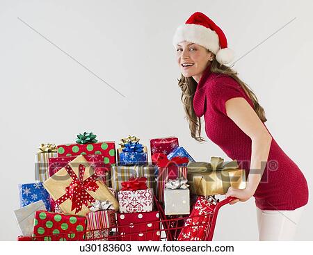 Shopping cart full of Christmas presents View Large Photo Image Stock Image - Shopping cart full of Christmas presents. Fotosearch