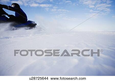 Picture - Snowmobile in motion. Fotosearch