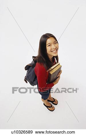 Student holding books View Large Photo Image Stock Photo - Student holding books. Fotosearch