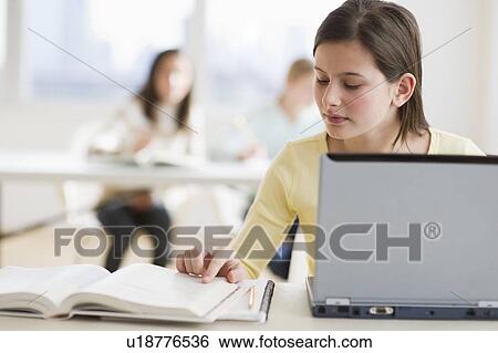 Stock Photograph - Student working. Fotosearch