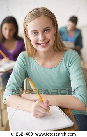 Stock Image - Student writing. Fotosearch