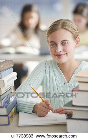 Stock Image - Student writing. Fotosearch