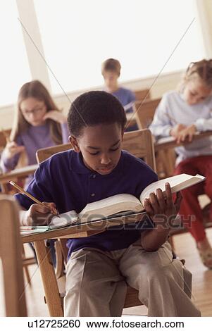 Stock Image - Students in classroom. Fotosearch