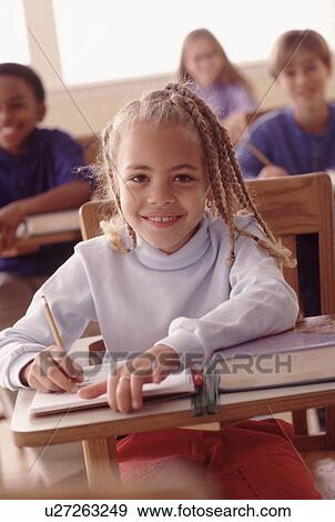 Stock Photo - Students in classroom. Fotosearch